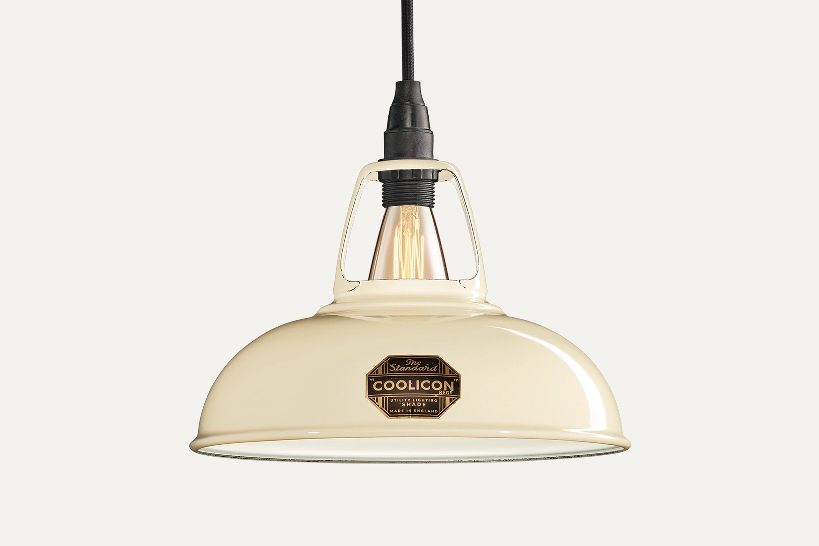 Classic Cream Coolicon lampshade with a black Industrial pendant set over a light cream background