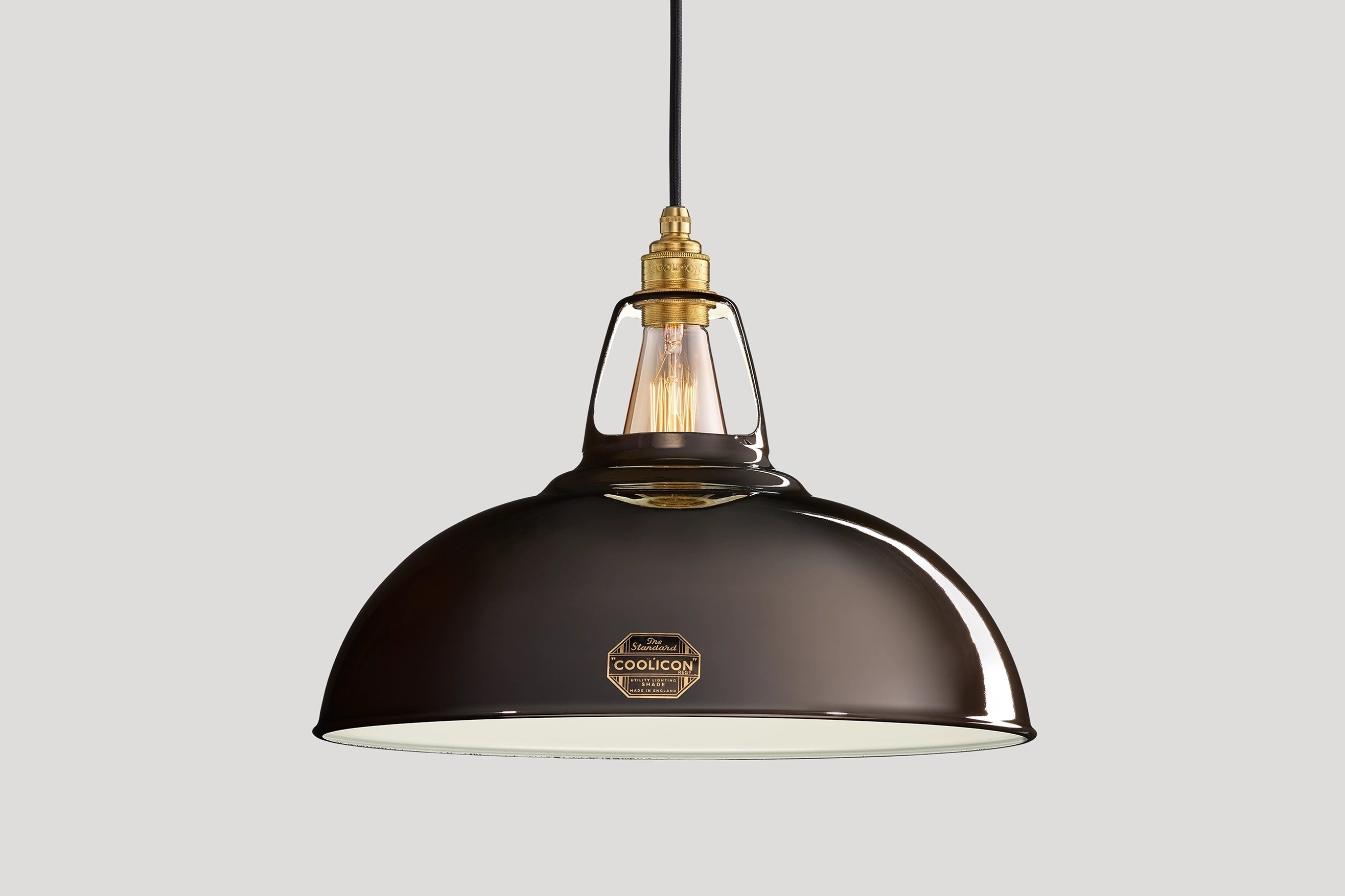 Large Pewter Coolicon lampshade with a Signature Brass pendant set over a light grey background