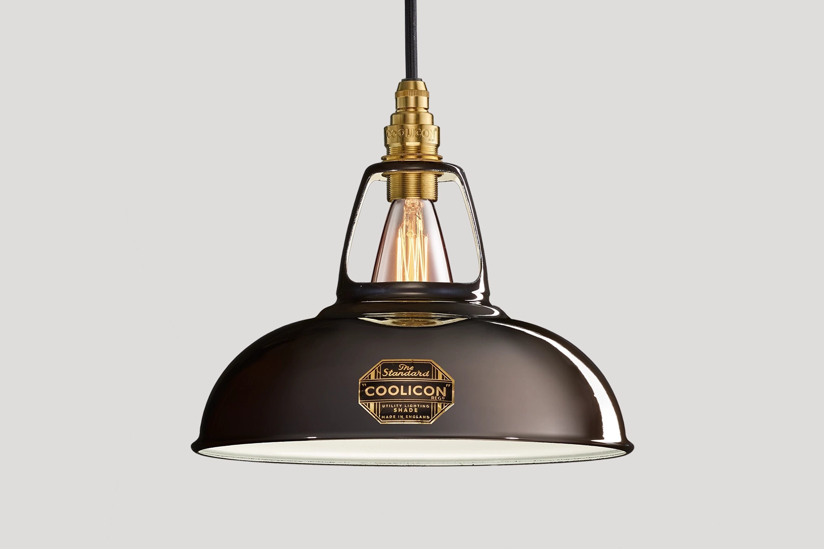 Pewter Coolicon lampshade with a Signature Brass pendant set over a light grey background