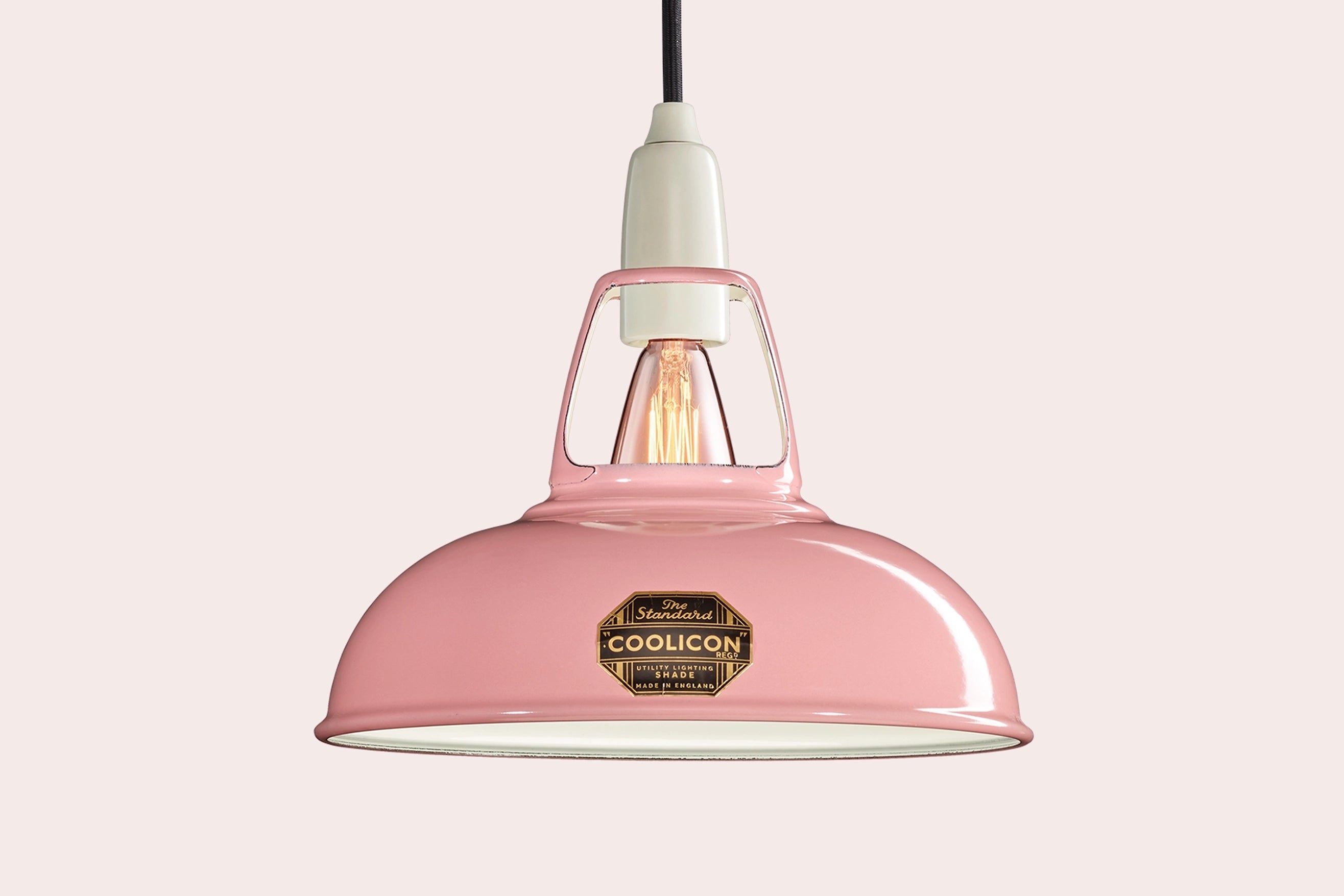 Powder Pink Coolicon lampshade with a Porcelain pendant set over a light pink background