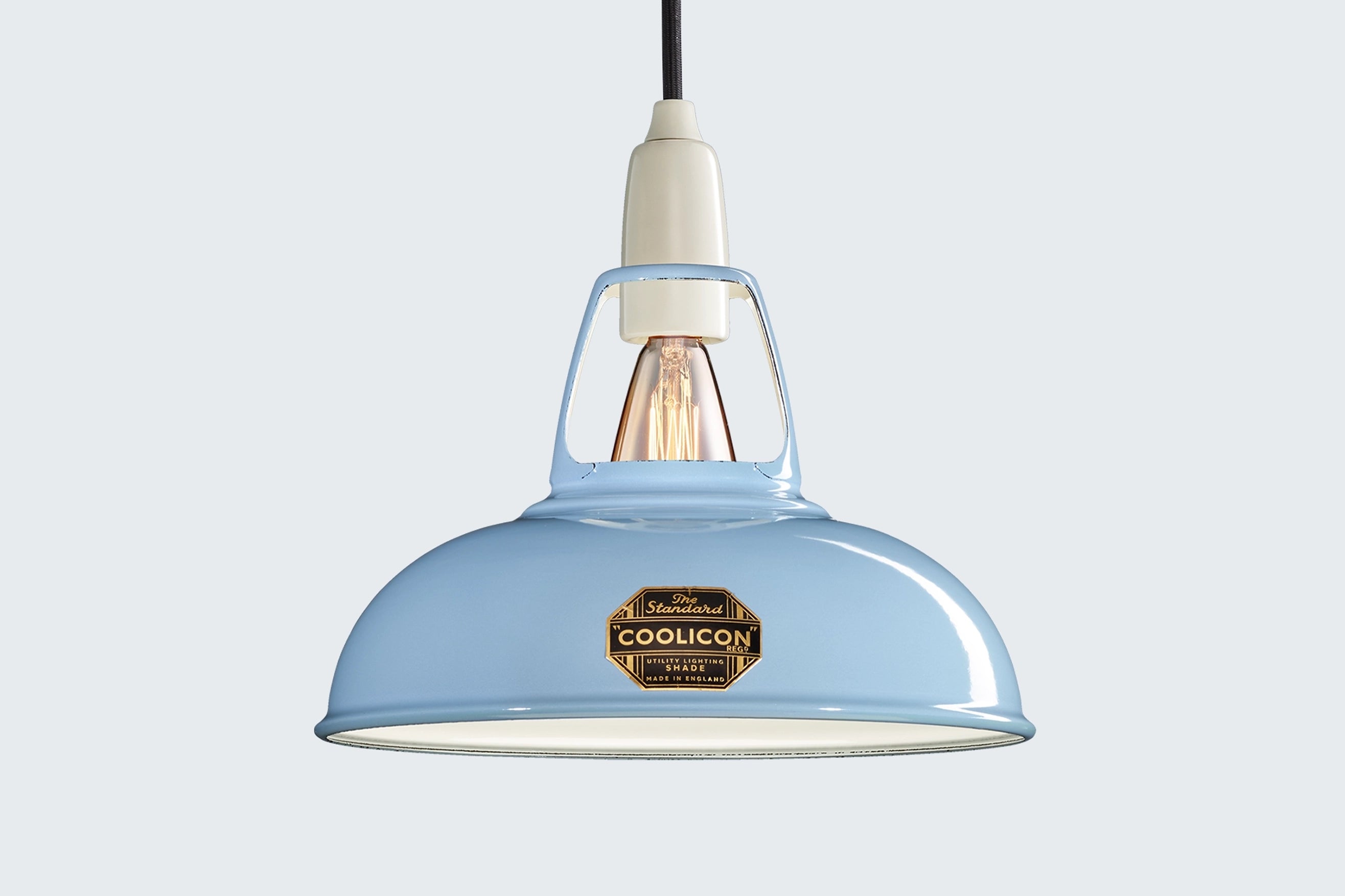 Sky Blue Coolicon lampshade with a Porcelain pendant set over a light blue background